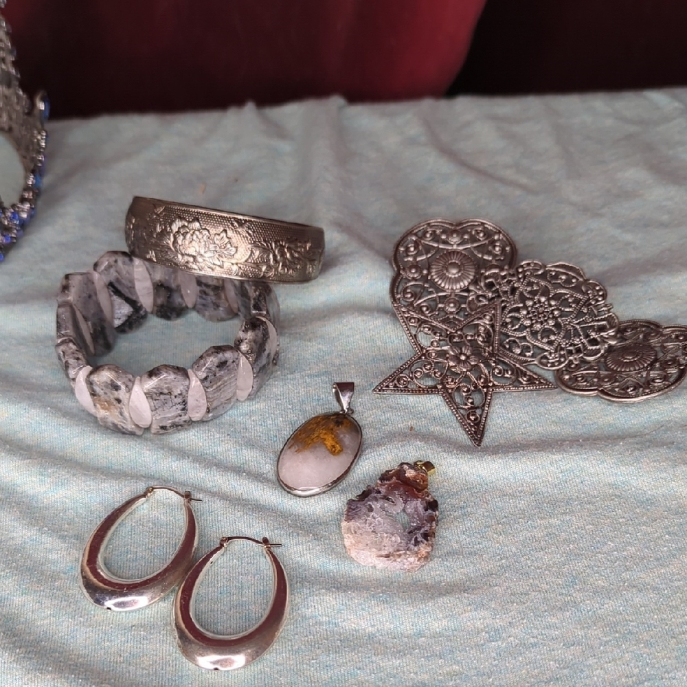 Silver and Gray Bracelets with Intricate Patterns and Textured Designs